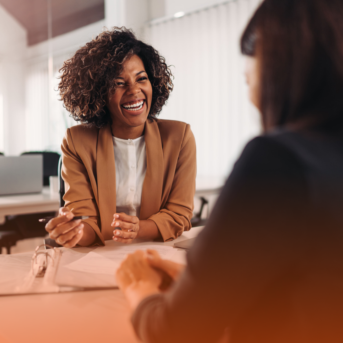 Professional woman in conversation laughing