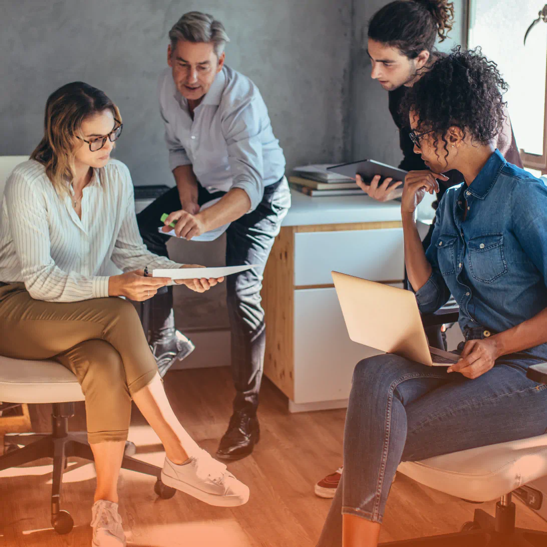 Four coworkers in discussion