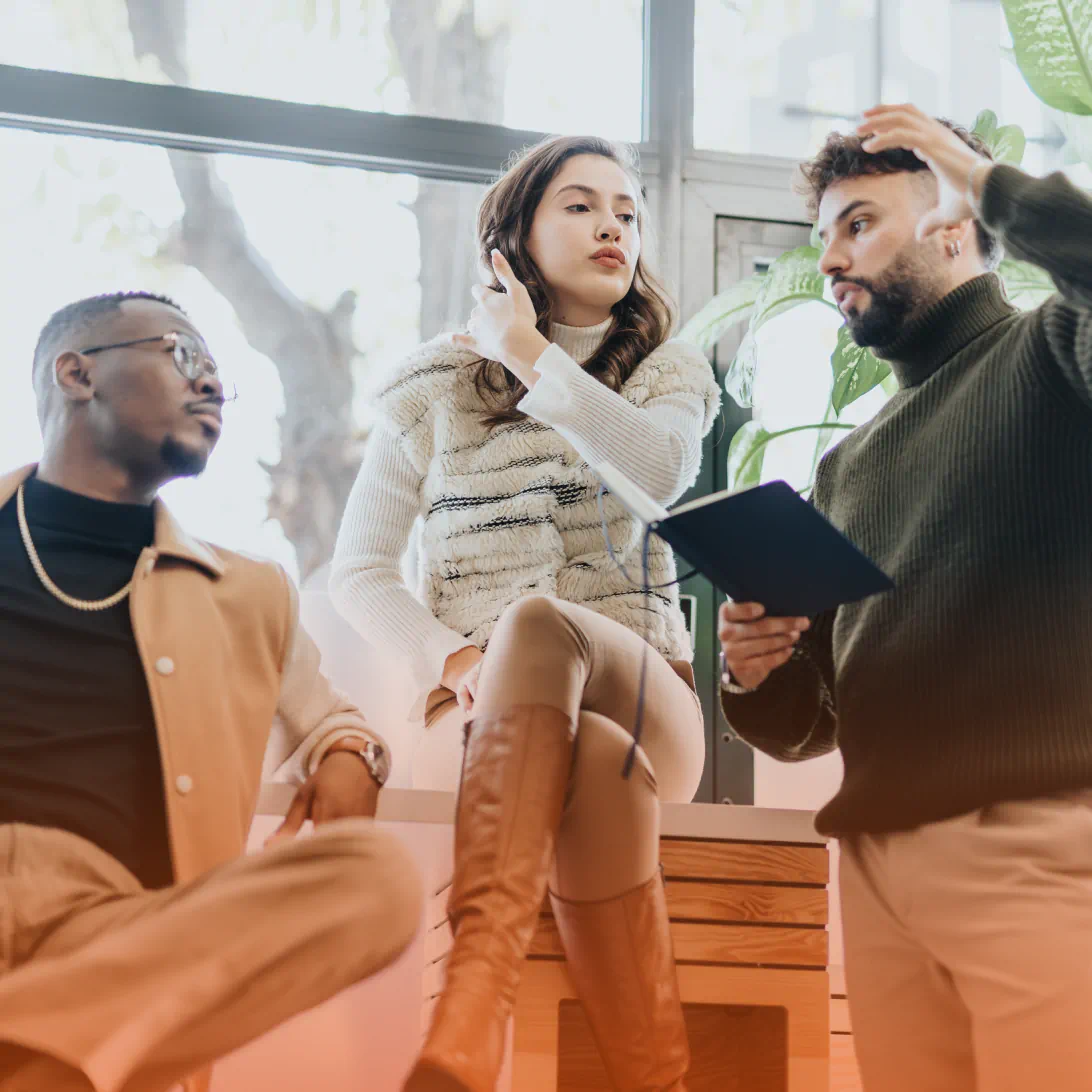 Three people having a discussion